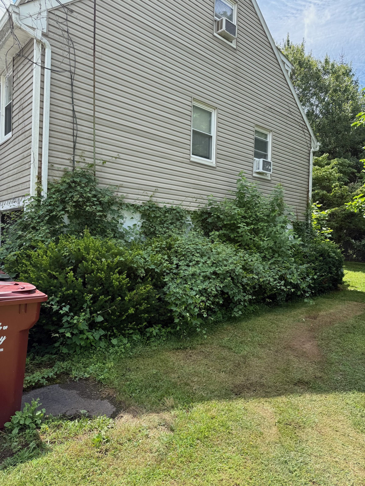 Mulch beds before seasonal refresh